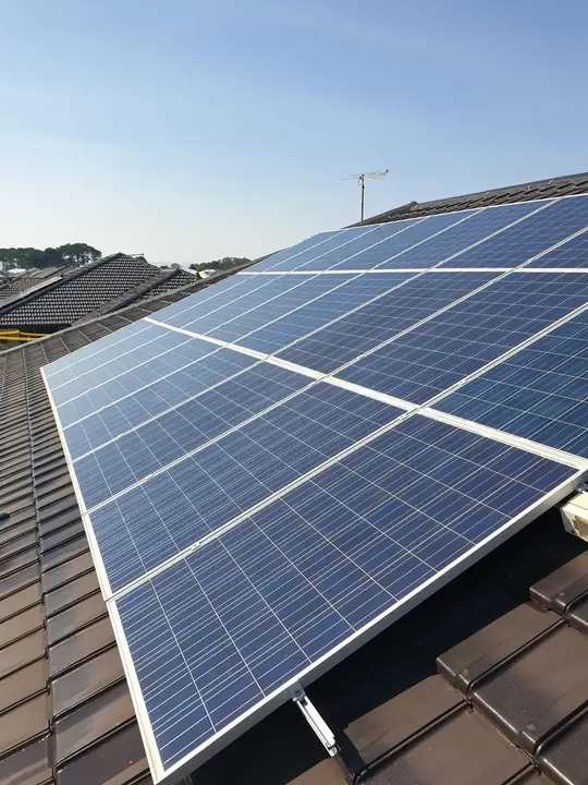 Cleaned solar panels on a dark tile roof