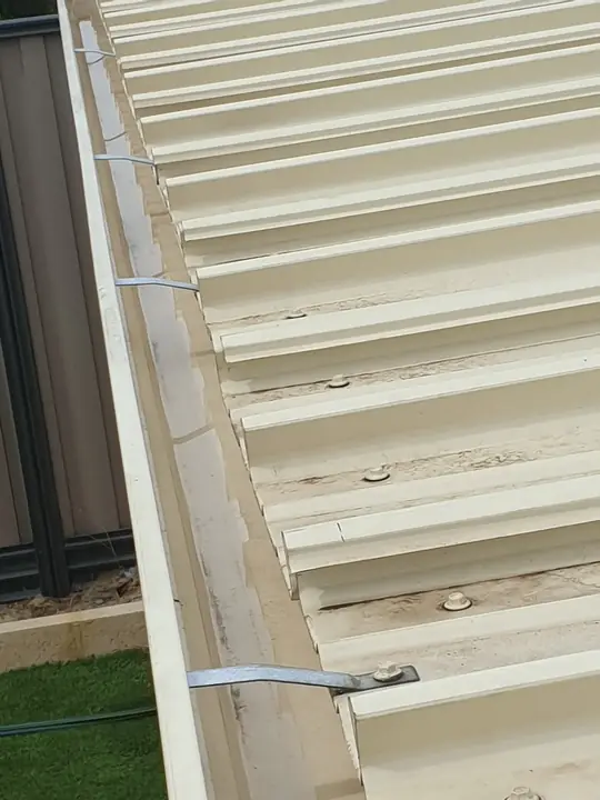 A cleared gutter on a Colorbond roof after gutter cleaning